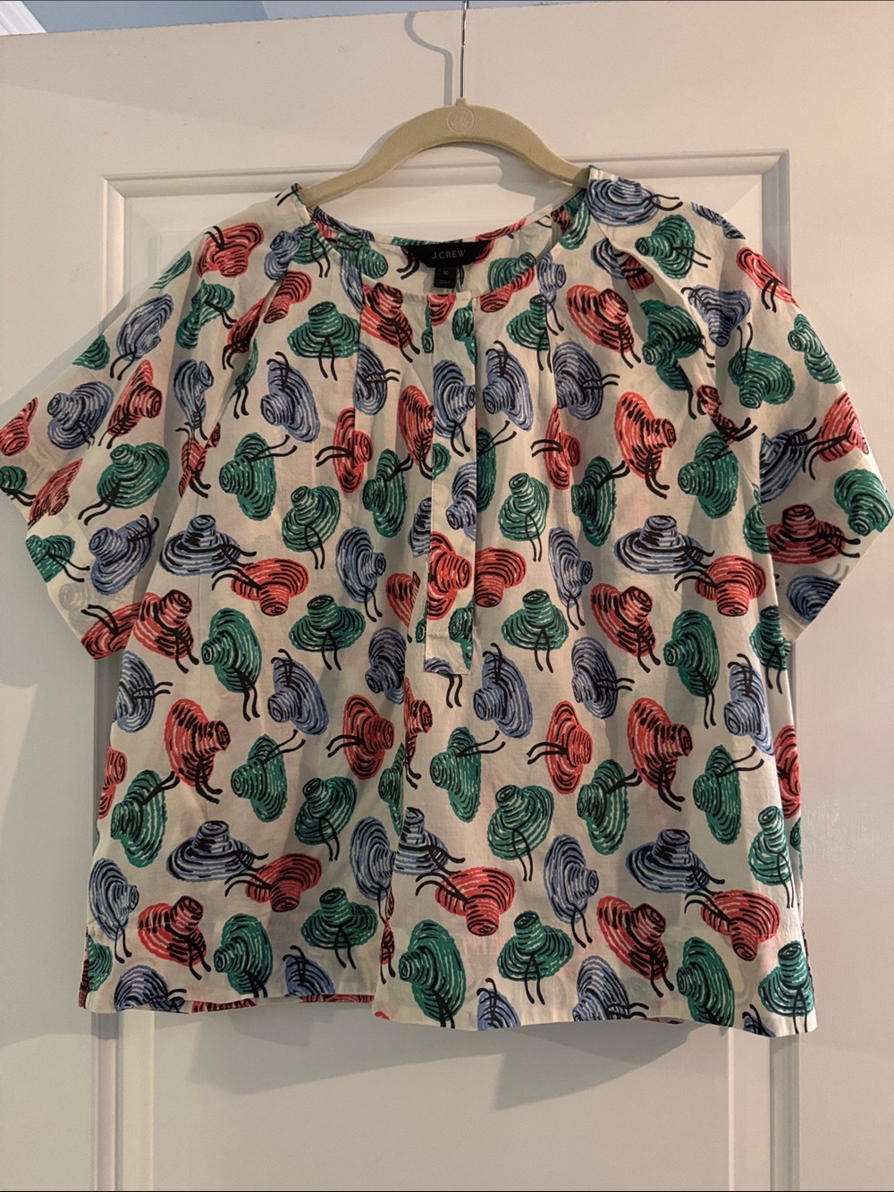 J. Crew Cream Short Sleeve Top with Green, Blue & Coral Hat Print